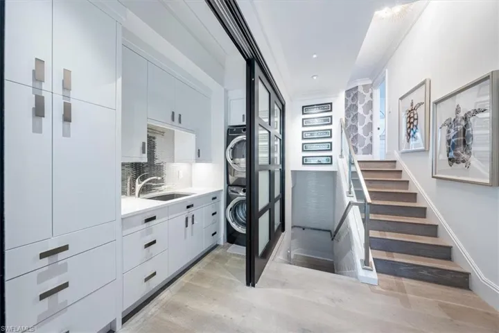 Hallway, laundry room and stairs to upper guest suites