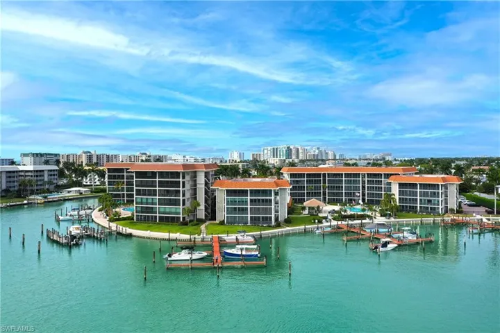Water view with a boat dock and nearby urban area