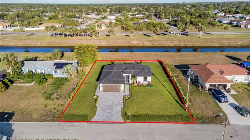 Aerial view with a residential view and a water view