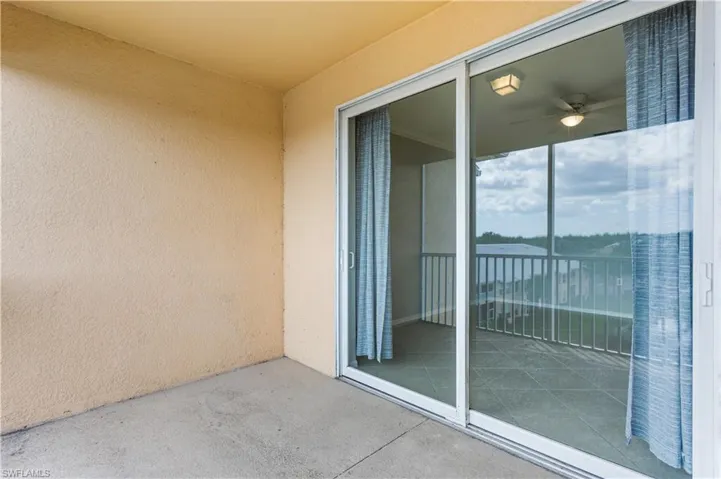 Balcony featuring ceiling fan