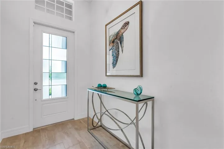 Entryway with light hardwood / wood-style flooring