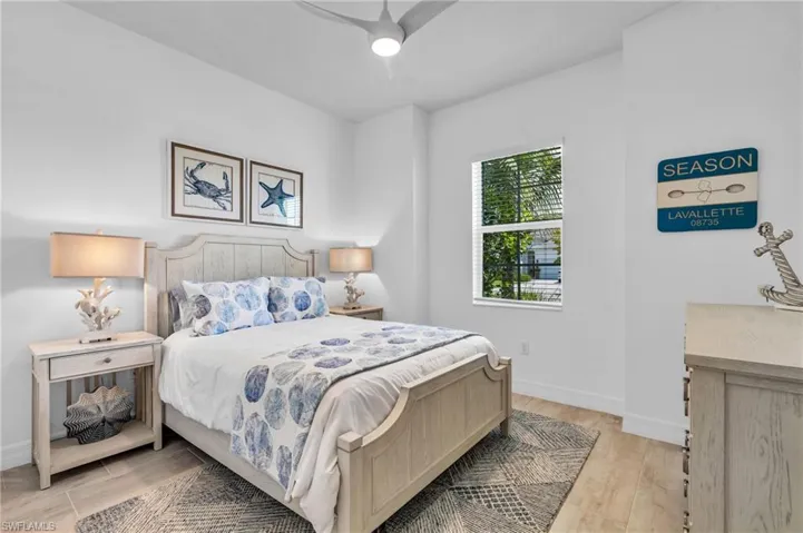 Bedroom with light wood-type flooring and ceiling fan