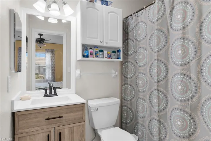 Full bathroom featuring a shower with curtain and vanity