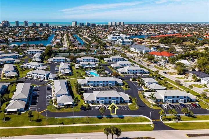 Aerial perspective of suburban area with a large body of water