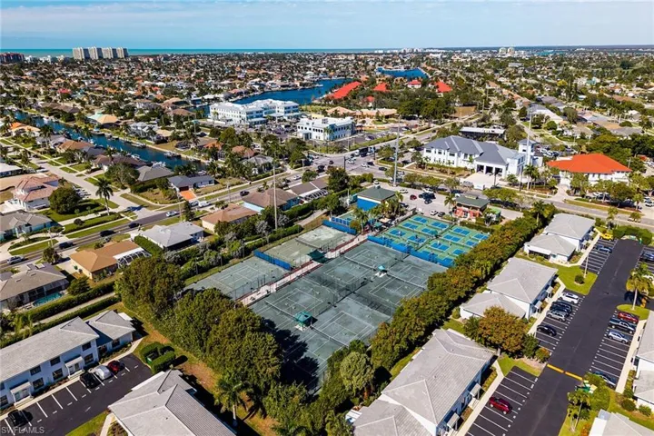 View of property location with a nearby body of water and nearby suburban area