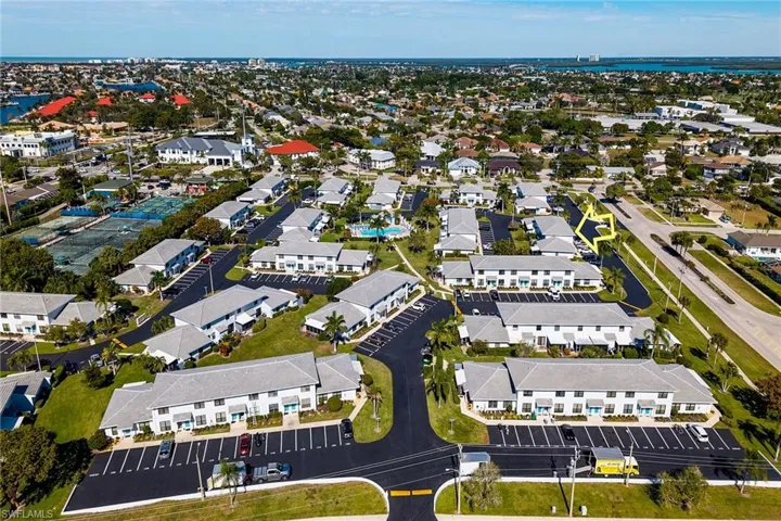 Aerial view of property and surrounding area with nearby suburban area