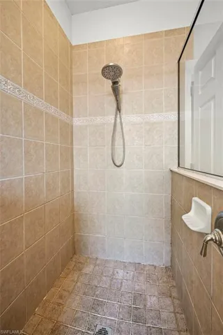 Bathroom featuring a tile shower