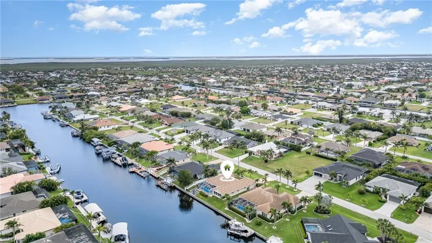 Drone / aerial view with a water view and a residential view