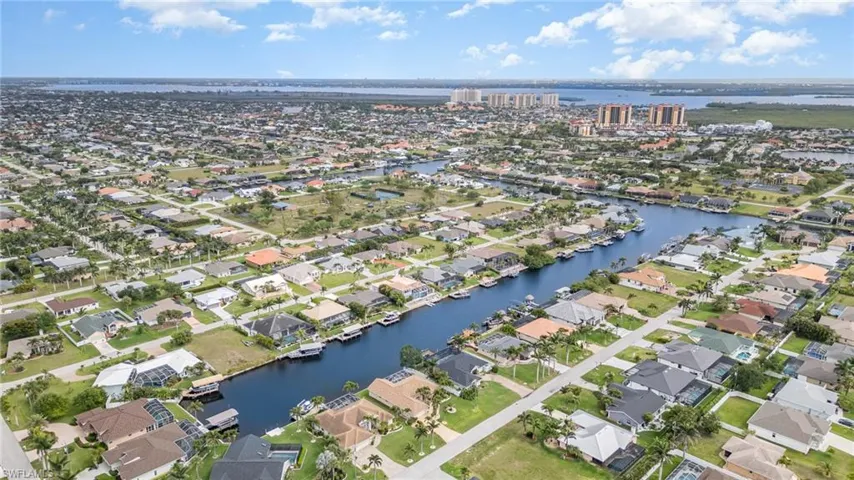 Bird's eye view featuring a water view and a residential view