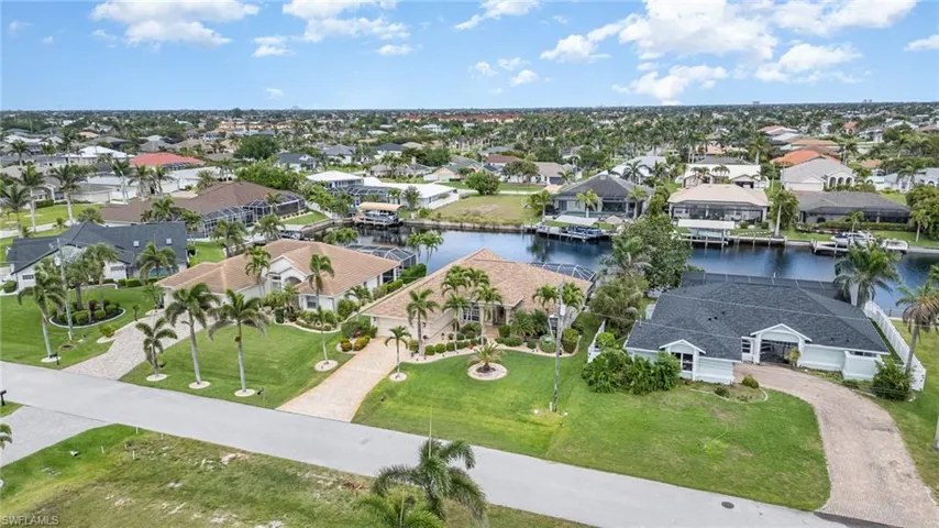 Drone / aerial view featuring a water view and a residential view