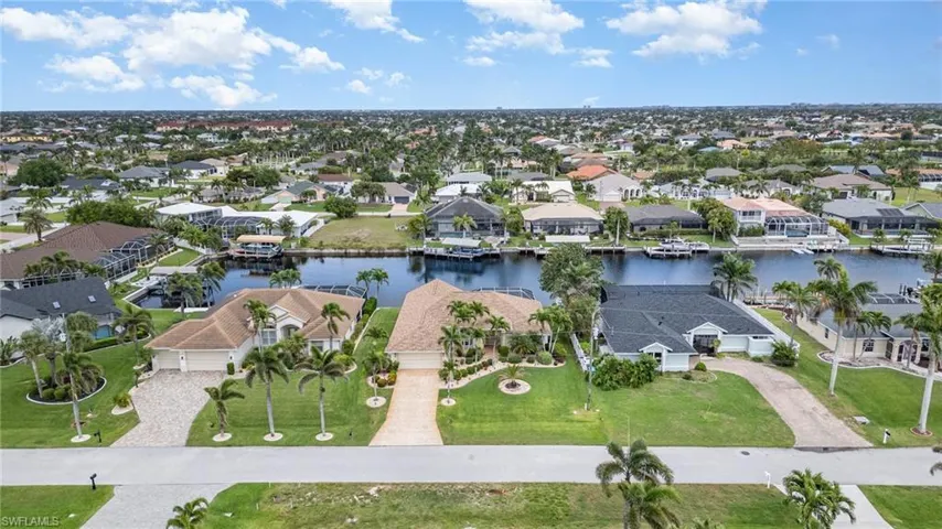 Drone / aerial view featuring a water view and a residential view