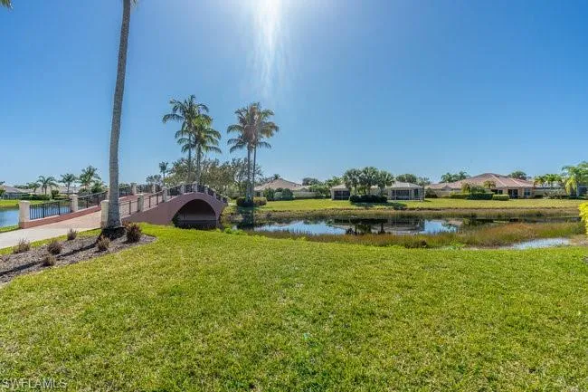View of yard with a water view