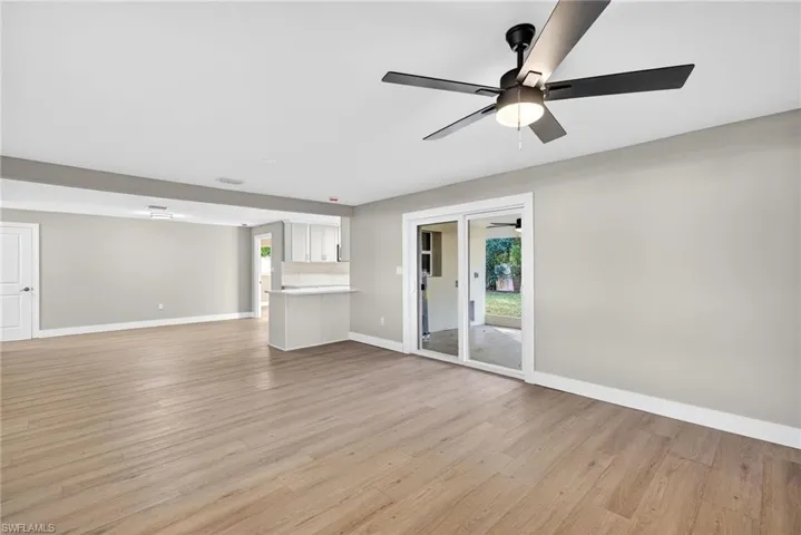 Living room with plenty of natural light and light wood-style floors