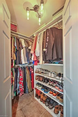 Spacious closet featuring tile patterned floors