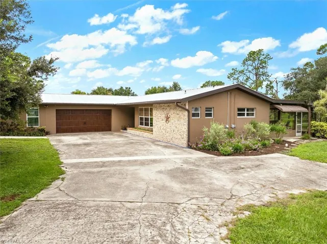 Ranch-style home featuring a garage