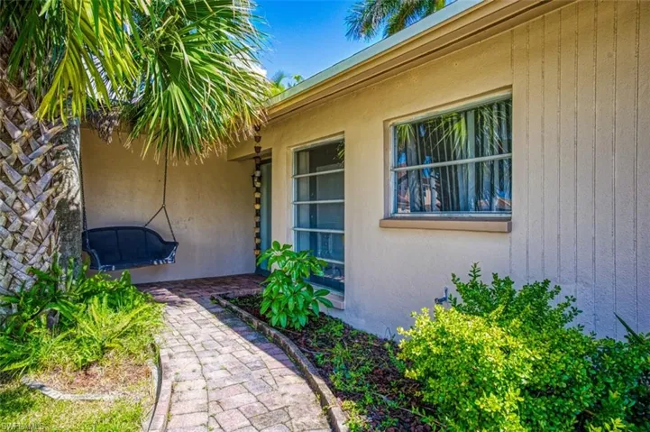 Doorway to property with stucco siding