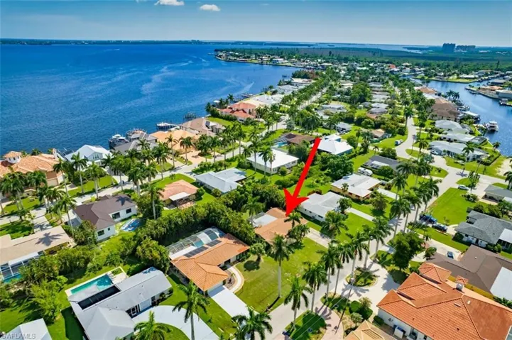 Birds eye view of property with a residential view and a water view
