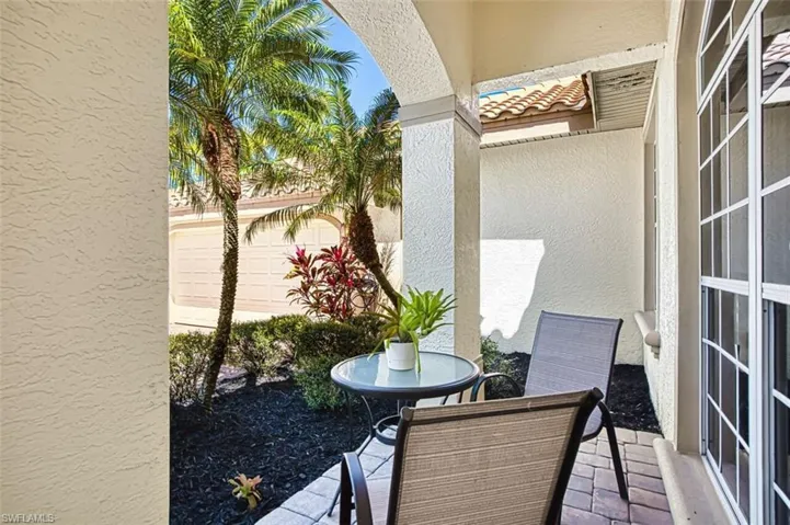 Balcony featuring outdoor dining area and a patio