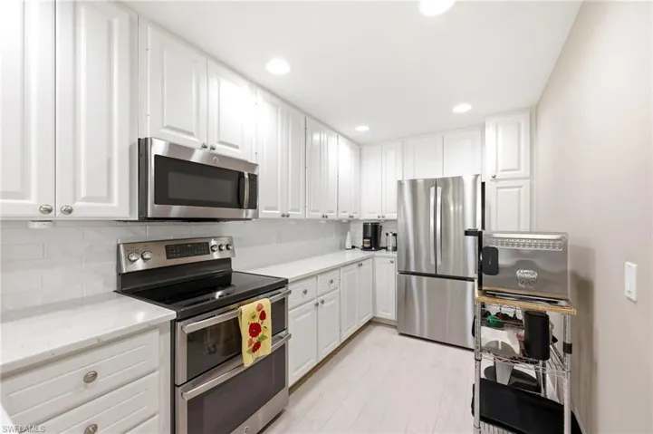 Custom cabinets and quartz countertops throughout