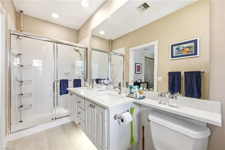 Master Bathroom with dual sinks and quartz countertops