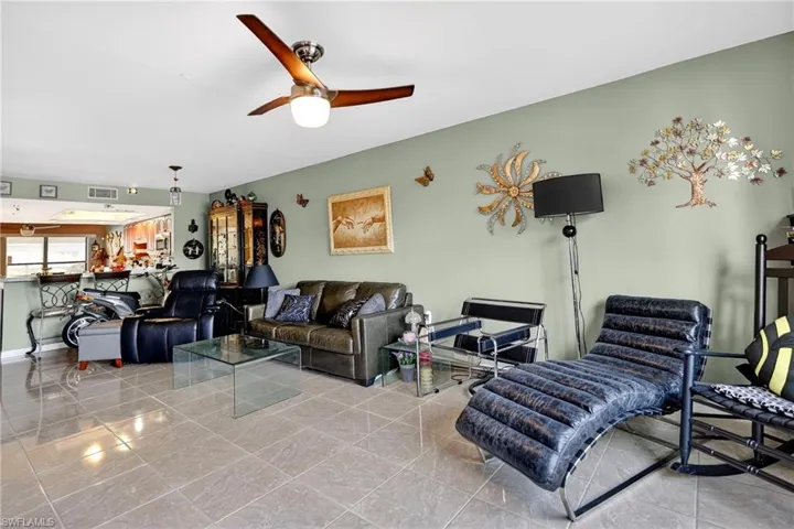Living area featuring ceiling fan
