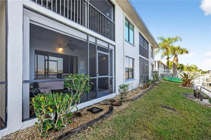 View of yard featuring a sunroom