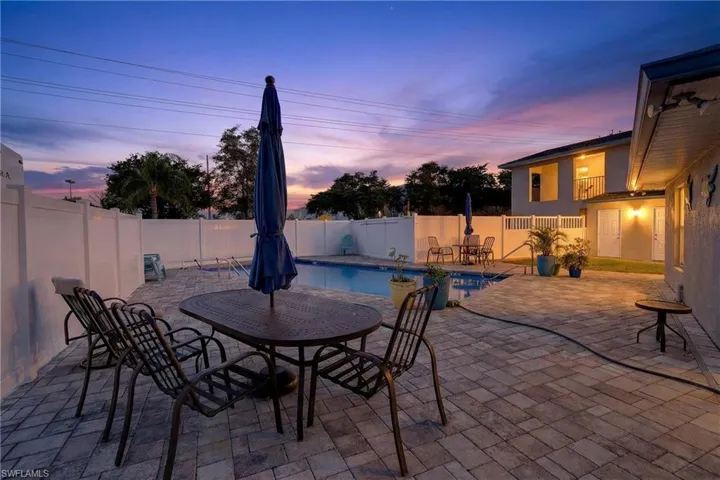 Fenced backyard with a patio area