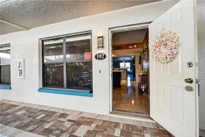 Property entrance with stucco siding