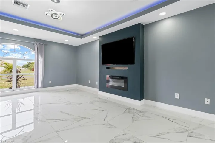 Cinema room with a raised ceiling