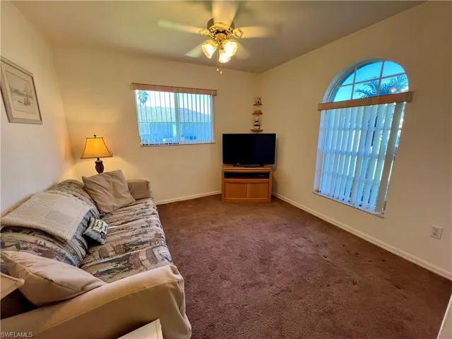 Guest bedroom featuring ceiling fan