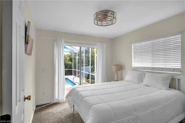 Guest Bedroom 1 with slider access to the lanai