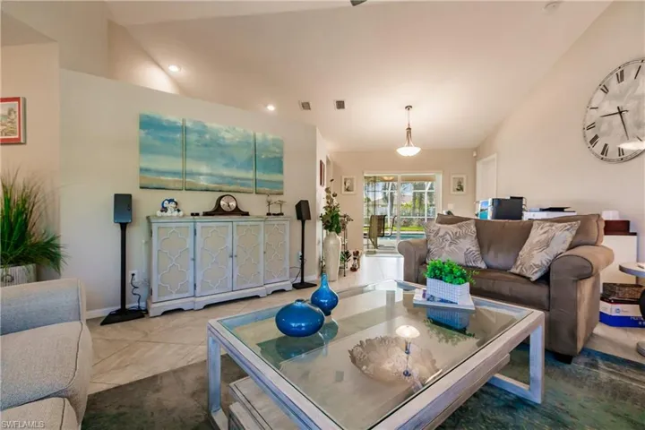 Living room featuring vaulted ceiling