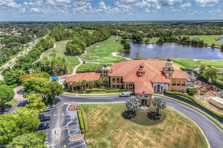 Drone / aerial view of a large body of water and a golf course