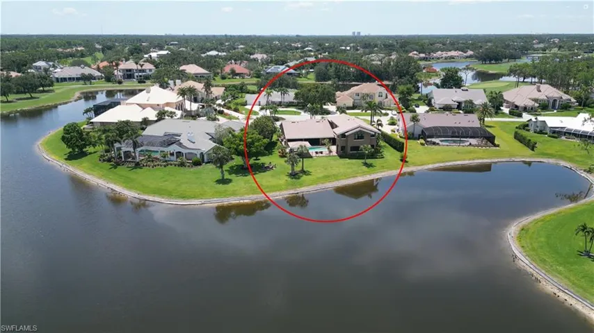 Aerial perspective of suburban area with a large body of water