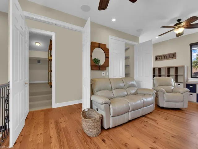 Living area featuring ceiling fan, light wood-type flooring, recessed lighting, and baseboards