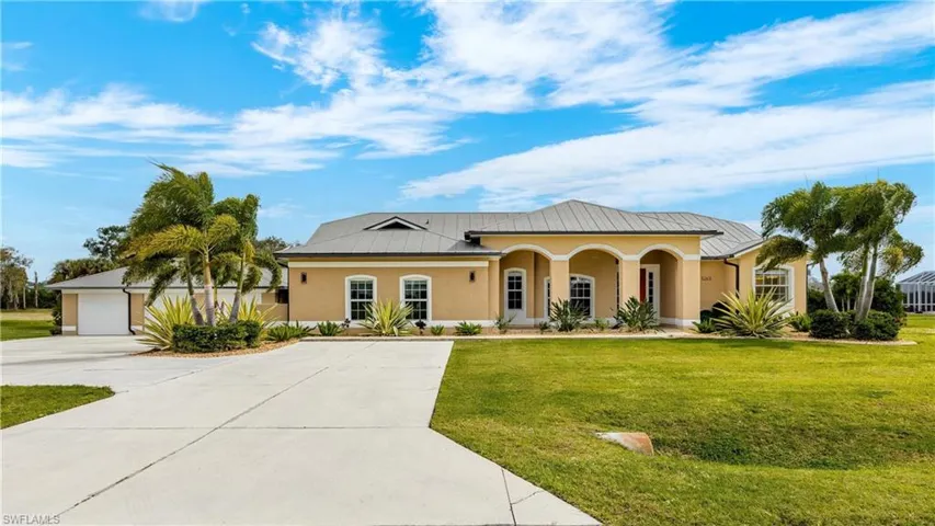 View of front of property featuring covered porch and a front lawn