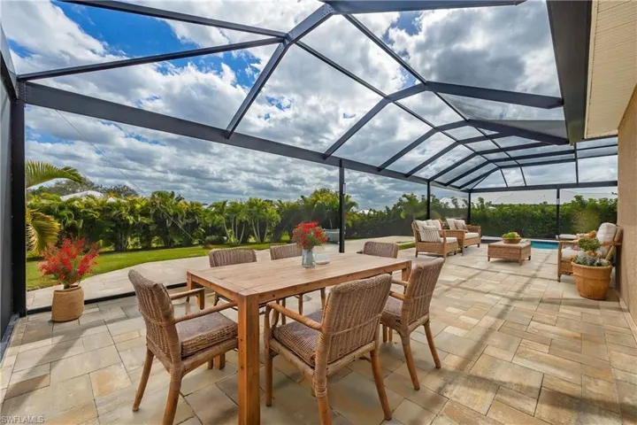 View of patio / terrace featuring glass enclosure and an outdoor hangout area