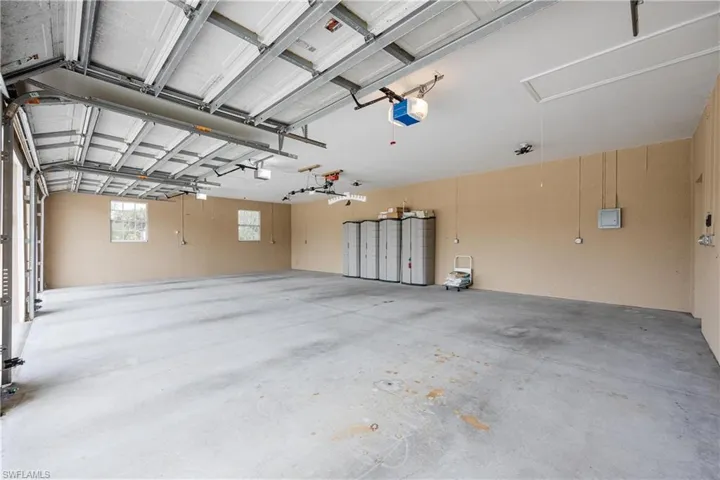 Garage featuring a garage door opener