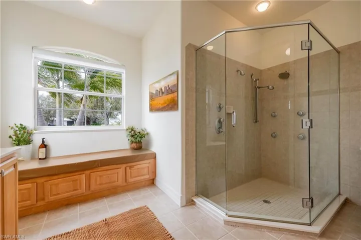 Primary bathroom featuring tile patterned floors and an enclosed shower