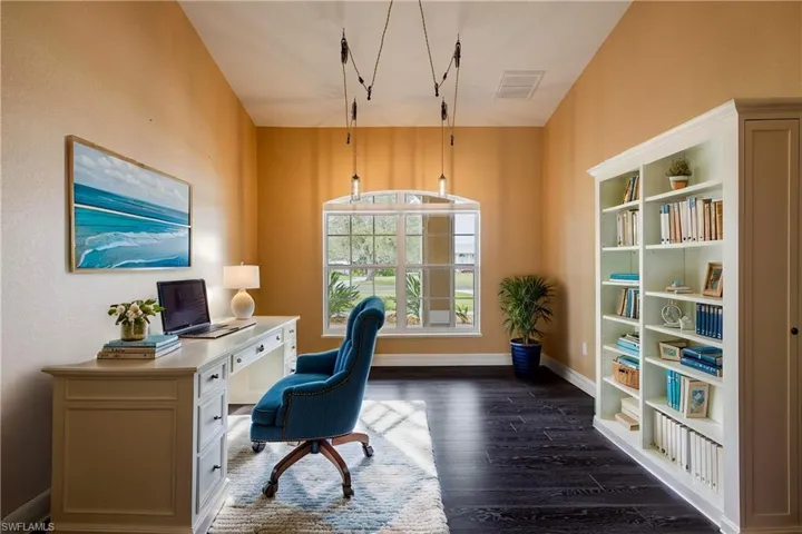 Office area with dark wood-type flooring
