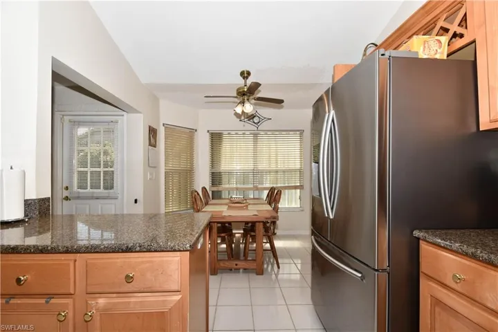 Updated Kitchen with Granite countertops, glass backsplash, stainless steel appliances