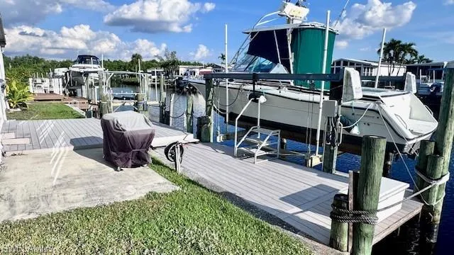 Canal right off Caloosahatchee River with Gulf AccessComposite Decking.  16k lb boat lift.  Boat also "available" for purchase