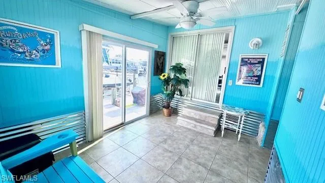 Lanai back of home with entrance to home or to waterfront patio.  This room could easily be transformed into a den/office or even another bedroom