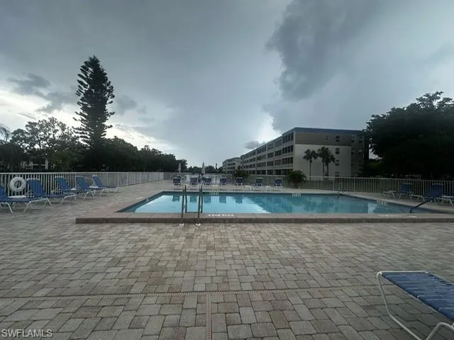 Community pool with a patio area