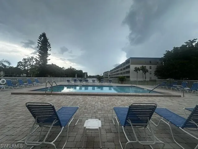 Community pool featuring a patio area