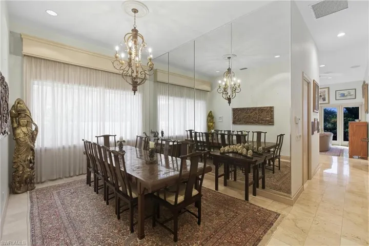 Dining room featuring recessed lighting and a chandelier