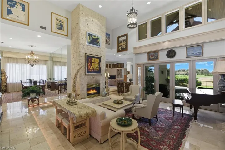 Community lobby with recessed lighting and a towering ceiling