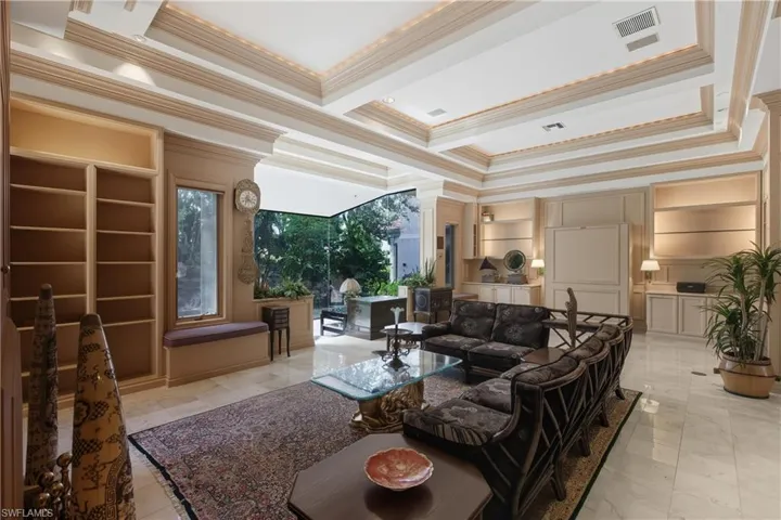 Living area featuring ornamental molding