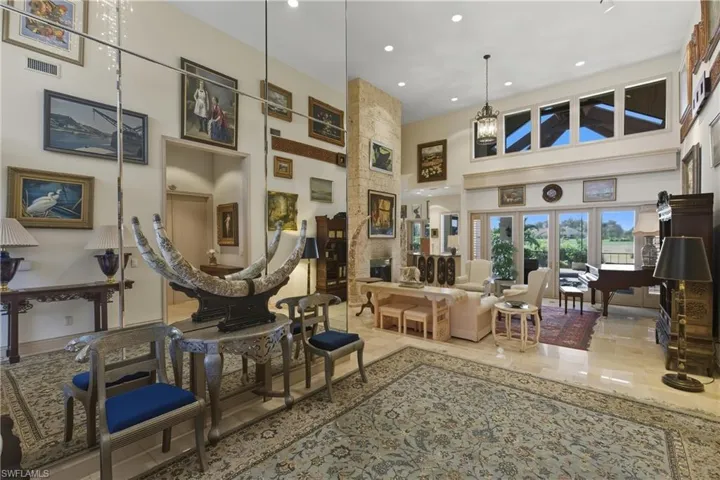 Common area featuring a high ceiling and recessed lighting