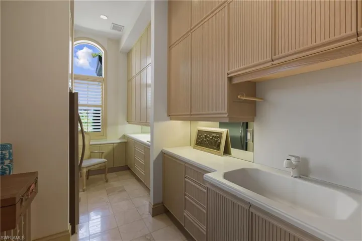 Bathroom with vanity and light tile patterned floors